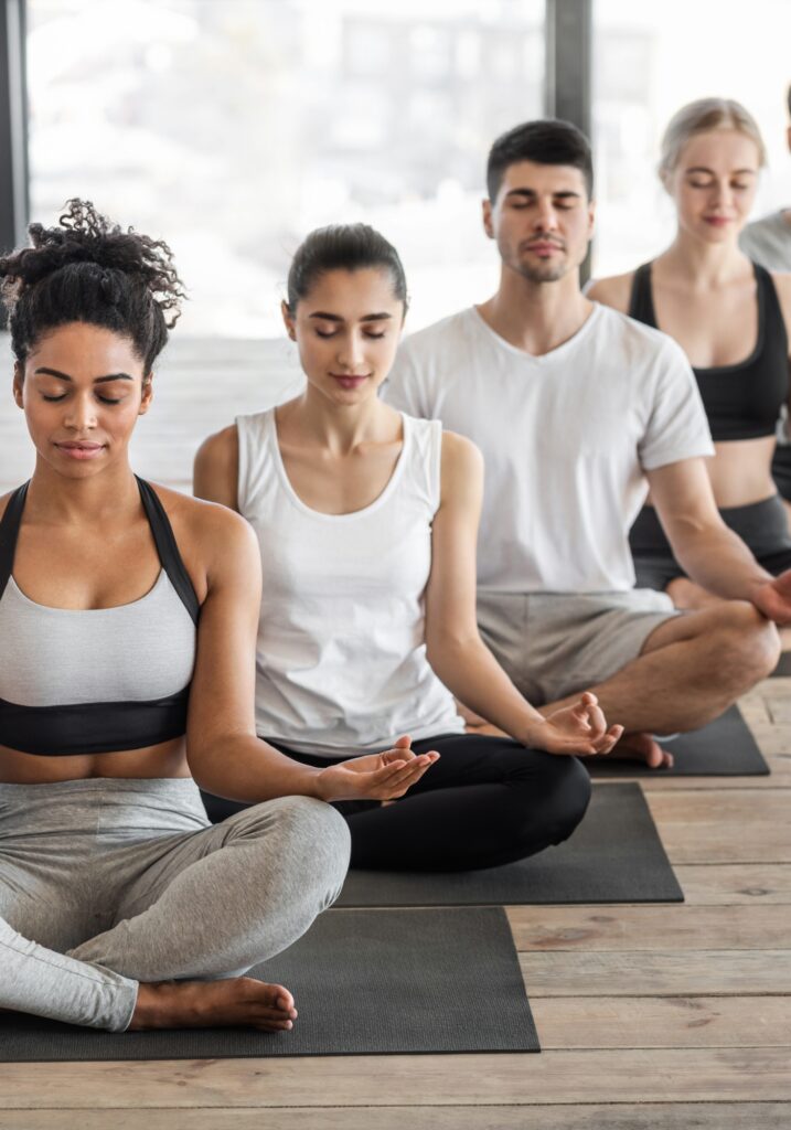 Group of people doing yoga