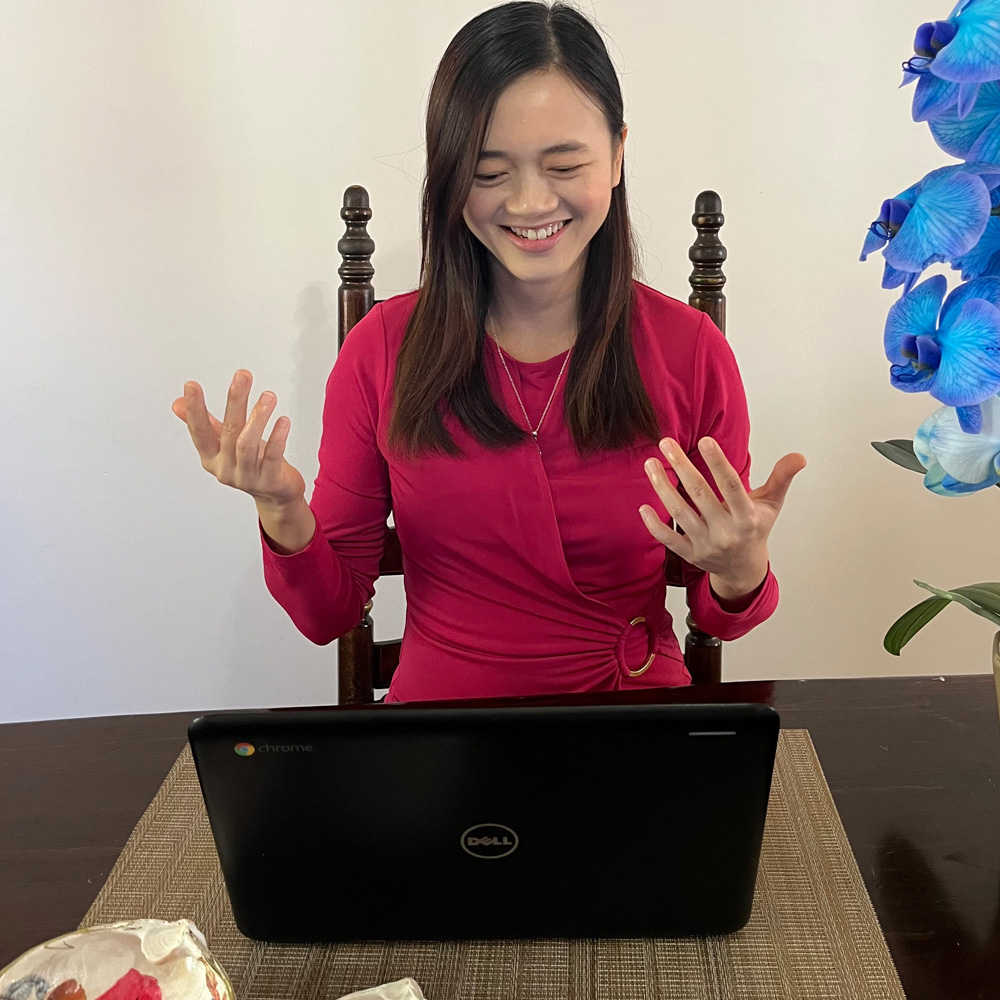 Seau Yin Chong happy using a computer